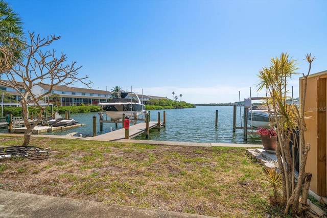 829 E Gulf Blvd Unit 107, Indian Rocks Beach, FL 33785 - dock featuring boat lift and a water view