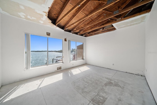 829 E Gulf Blvd Unit 107, Indian Rocks Beach, FL 33785 - spare room featuring vaulted ceiling and a water view