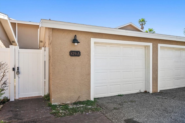 829 E Gulf Blvd Unit 107, Indian Rocks Beach, FL 33785 - garage featuring a gate