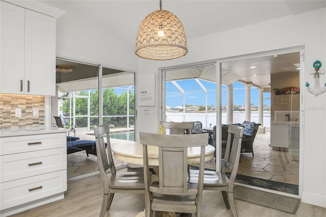 1109 SW 44th St, Cape Coral, FL 33914 - dining area with a water view and light wood-type flooring