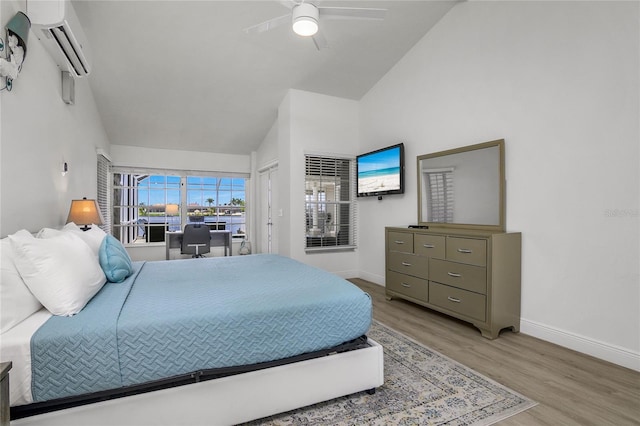 1109 SW 44th St, Cape Coral, FL 33914 - bedroom featuring high vaulted ceiling, baseboards, light wood-style flooring, a wall mounted air conditioner, and ceiling fan