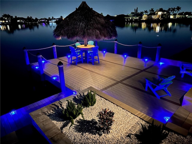 1109 SW 44th St, Cape Coral, FL 33914 - dock featuring a deck with water view and outdoor dining space