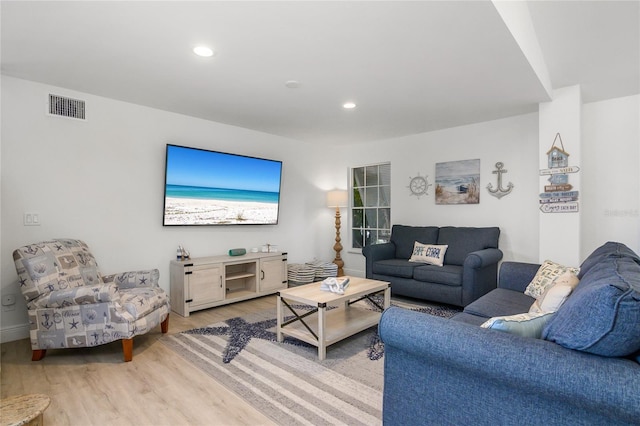 1109 SW 44th St, Cape Coral, FL 33914 - living room featuring light wood finished floors and recessed lighting