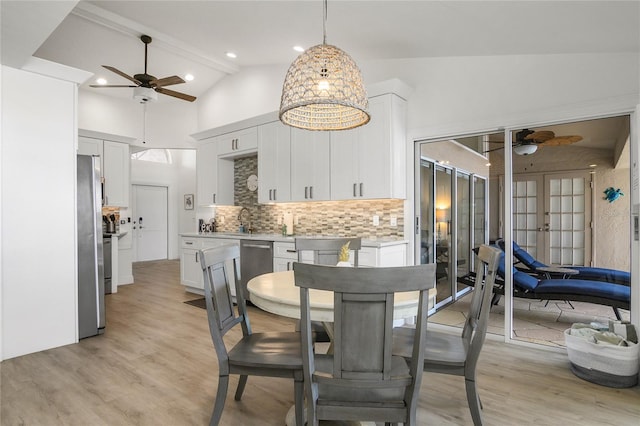 1109 SW 44th St, Cape Coral, FL 33914 - dining area with a ceiling fan, light wood-style floors, lofted ceiling, french doors, and recessed lighting