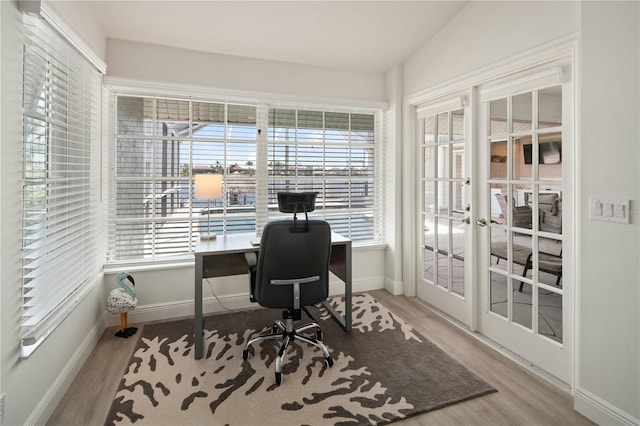 1109 SW 44th St, Cape Coral, FL 33914 - home office featuring wood finished floors, baseboards, and french doors