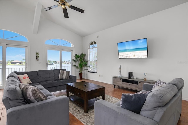 1109 SW 44th St, Cape Coral, FL 33914 - tiled living area with a ceiling fan, a water view, high vaulted ceiling, and baseboards