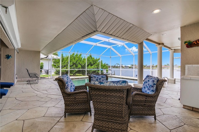 1109 SW 44th St, Cape Coral, FL 33914 - view of patio / terrace featuring a water view, a lanai, and an outdoor pool