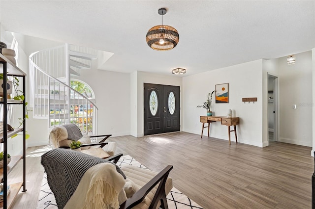640 Kenneth Way, Tarpon Springs, FL 34689 - foyer entrance with stairway, baseboards, and light wood-style flooring