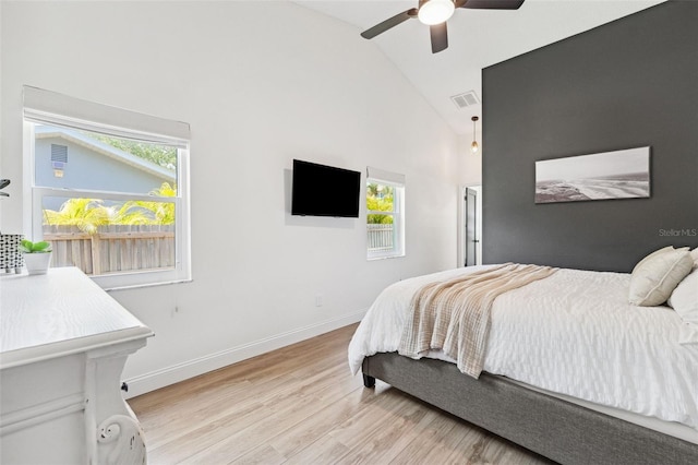 640 Kenneth Way, Tarpon Springs, FL 34689 - bedroom featuring light wood-style floors, high vaulted ceiling, multiple windows, and visible vents