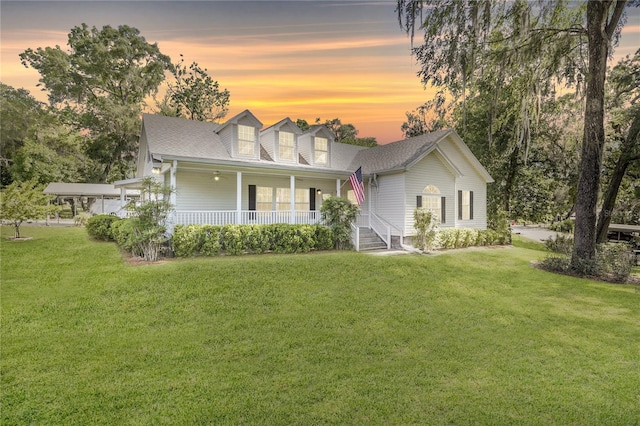 7165 Crk 655, Bushnell, FL 33513 - view of front of house with a porch, a lawn, and a shingled roof