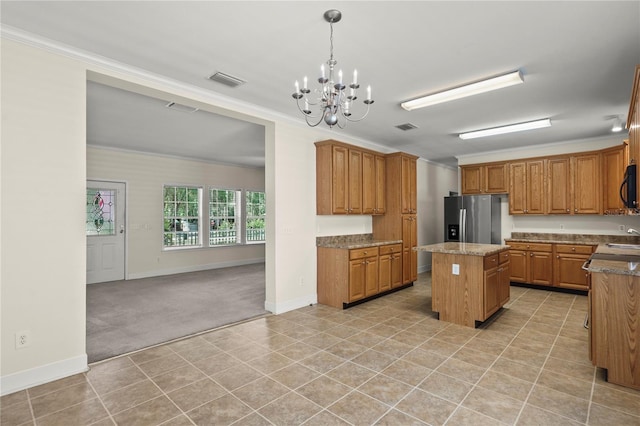 7165 Crk 655, Bushnell, FL 33513 - kitchen featuring stainless steel fridge with ice dispenser, a center island, black microwave, baseboards, and a chandelier