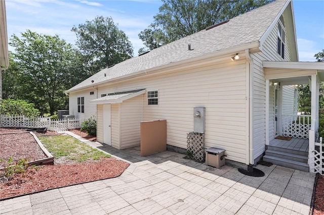 7165 Crk 655, Bushnell, FL 33513 - rear view of house with a patio, a shingled roof, and fence