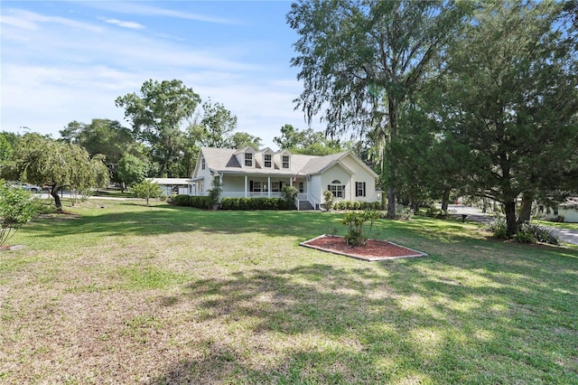 7165 Crk 655, Bushnell, FL 33513 - cape cod house featuring a front yard and covered porch