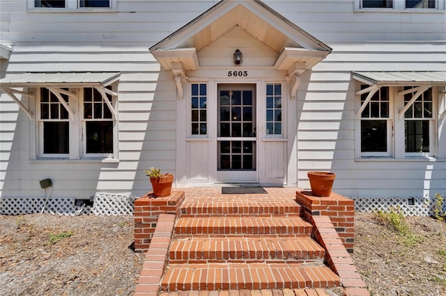 5603 Palmetto Rd, New Port Richey, FL 34652 - doorway to property featuring crawl space