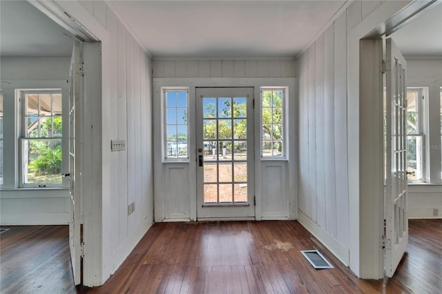 5603 Palmetto Rd, New Port Richey, FL 34652 - entryway with crown molding, dark wood-style flooring, and visible vents