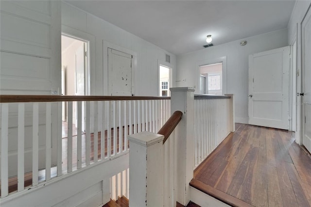 5603 Palmetto Rd, New Port Richey, FL 34652 - corridor with visible vents, an upstairs landing, and hardwood / wood-style floors