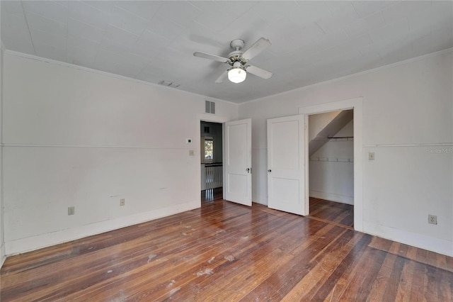 5603 Palmetto Rd, New Port Richey, FL 34652 - unfurnished bedroom featuring wood-type flooring, ceiling fan, visible vents, and ornamental molding