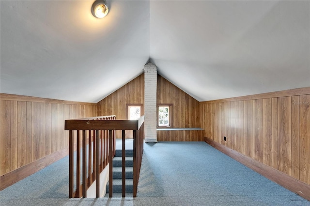5603 Palmetto Rd, New Port Richey, FL 34652 - additional living space with wood walls, lofted ceiling, and carpet