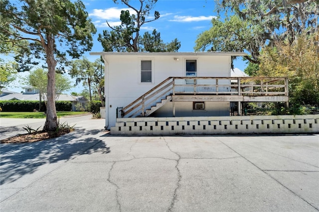 5603 Palmetto Rd, New Port Richey, FL 34652 - view of front of house with a wooden deck and stairs
