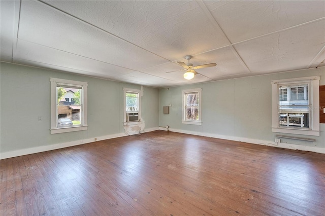 5603 Palmetto Rd, New Port Richey, FL 34652 - spare room featuring baseboards, ceiling fan, cooling unit, and hardwood / wood-style flooring