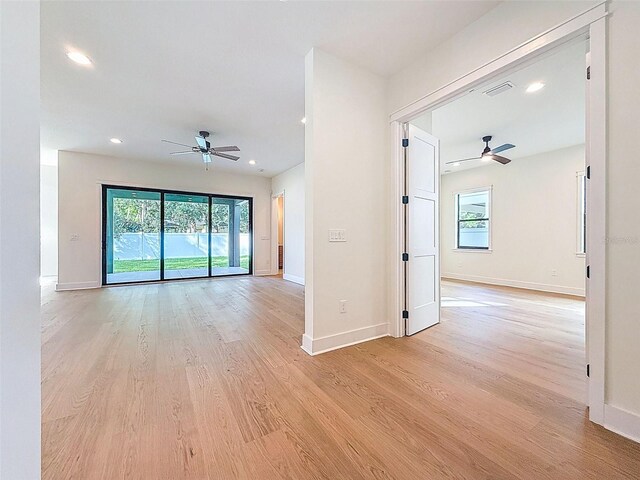 unfurnished room with recessed lighting, ceiling fan, baseboards, and light wood finished floors