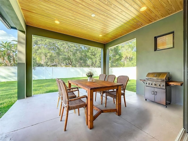 sunroom featuring outdoor dining space