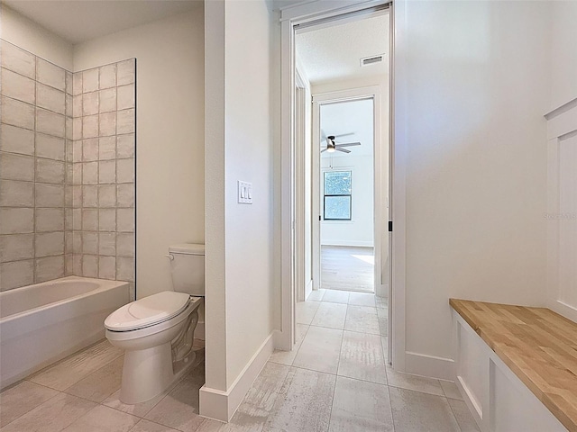 full bathroom featuring visible vents, ceiling fan, tile patterned flooring, and toilet