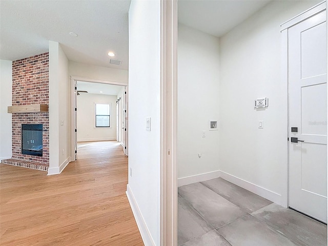 corridor featuring baseboards, recessed lighting, light wood-style flooring, and visible vents