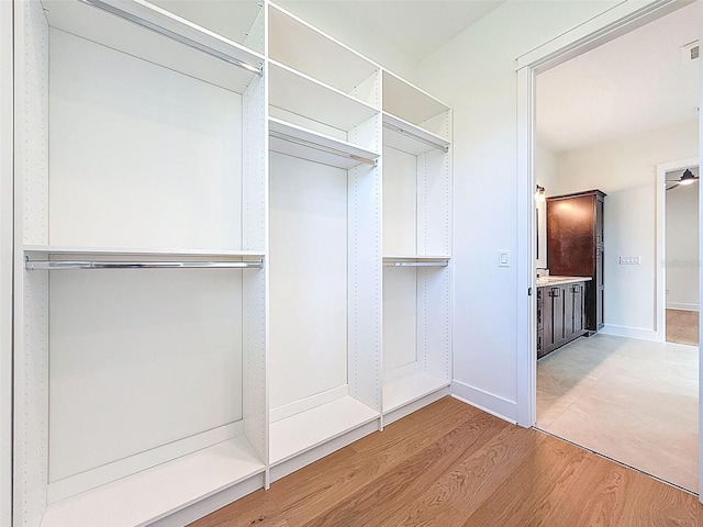 spacious closet with visible vents and light wood-type flooring