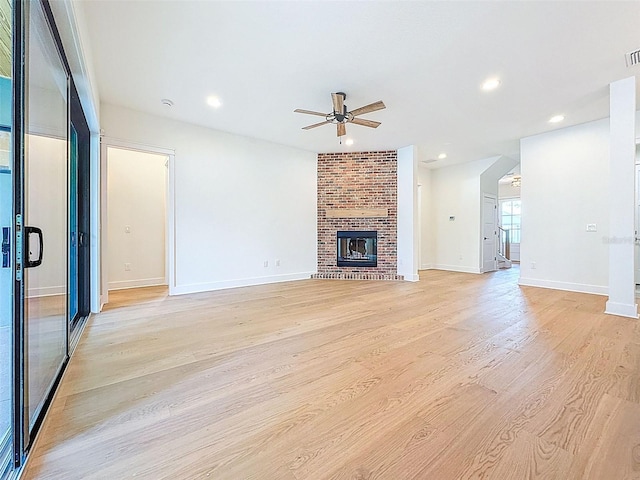 unfurnished living room featuring baseboards, a ceiling fan, recessed lighting, and light wood-style flooring