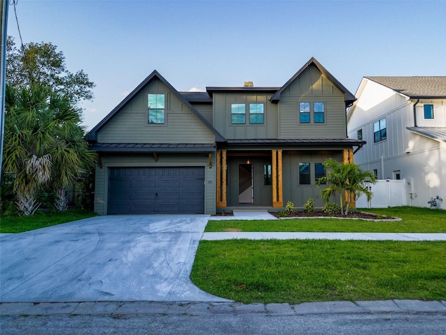 view of front of home featuring a front lawn, covered porch, board and batten siding, concrete driveway, and an attached garage