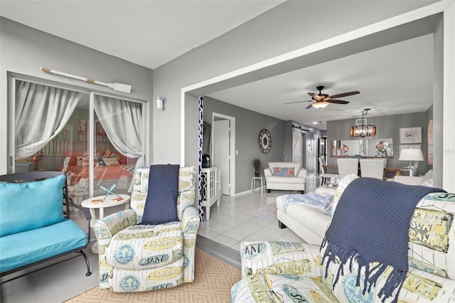 tiled living room featuring baseboards and ceiling fan with notable chandelier