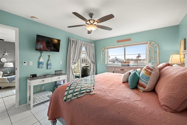 bedroom with baseboards, a ceiling fan, and tile patterned floors