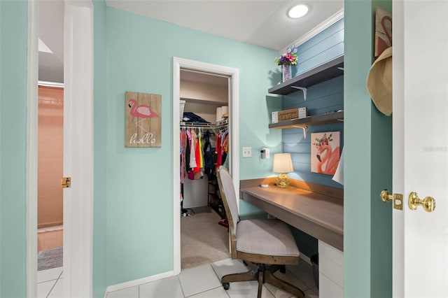 tiled home office featuring baseboards
