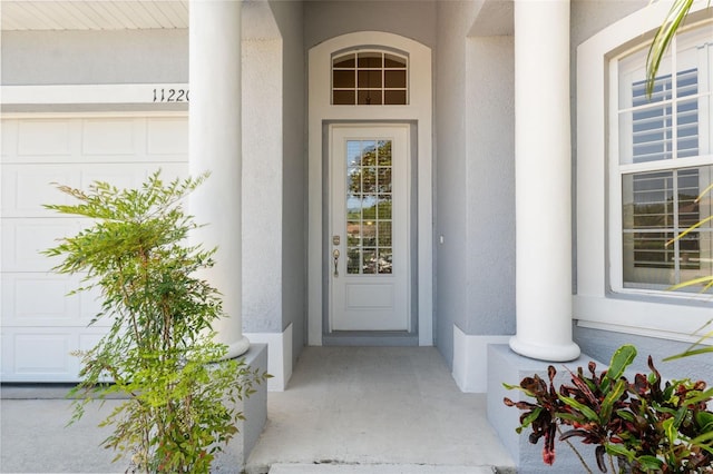 11220 Godwit Ct, New Port Richey, FL 34654 - property entrance featuring stucco siding