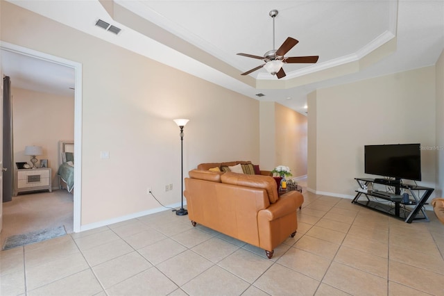 11220 Godwit Ct, New Port Richey, FL 34654 - living room with a tray ceiling, ceiling fan, light tile patterned floors, ornamental molding, and baseboards