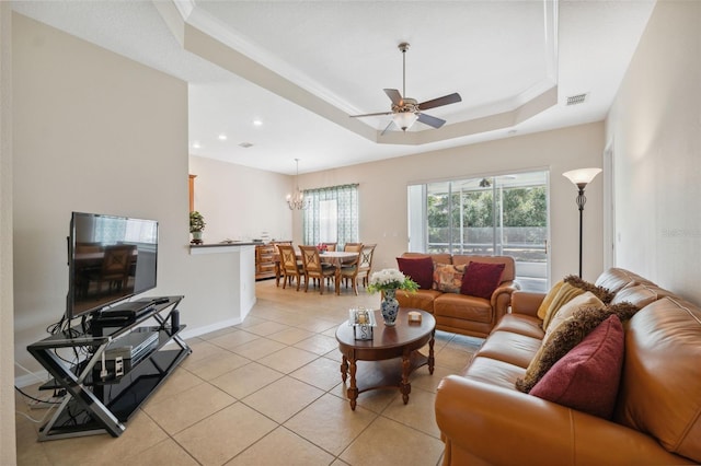 11220 Godwit Ct, New Port Richey, FL 34654 - living room with a raised ceiling, a ceiling fan, light tile patterned flooring, ornamental molding, and recessed lighting