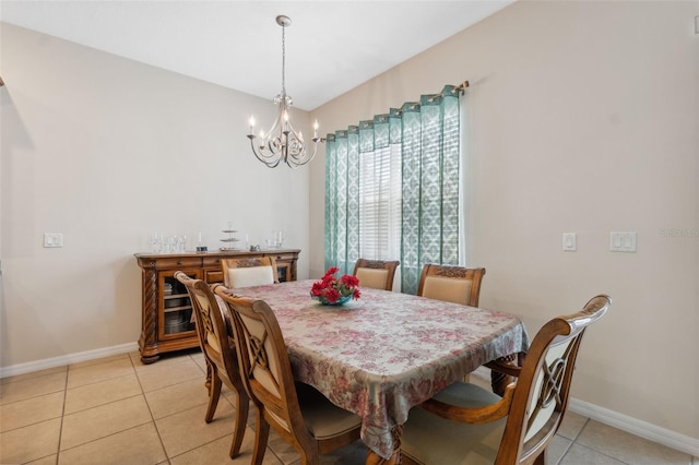 11220 Godwit Ct, New Port Richey, FL 34654 - dining room with a chandelier, light tile patterned flooring, and baseboards