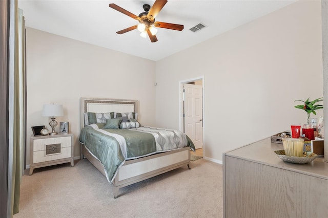 11220 Godwit Ct, New Port Richey, FL 34654 - bedroom with light colored carpet, baseboards, and ceiling fan