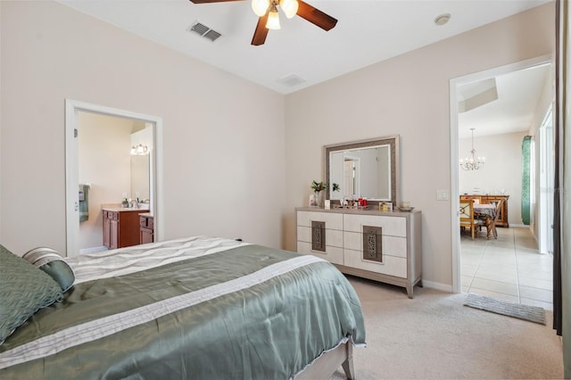 11220 Godwit Ct, New Port Richey, FL 34654 - bedroom with a chandelier, light carpet, connected bathroom, ceiling fan, and baseboards