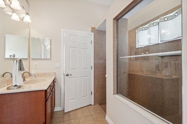 11220 Godwit Ct, New Port Richey, FL 34654 - full bath featuring tile patterned flooring, a tile shower, vanity, and baseboards