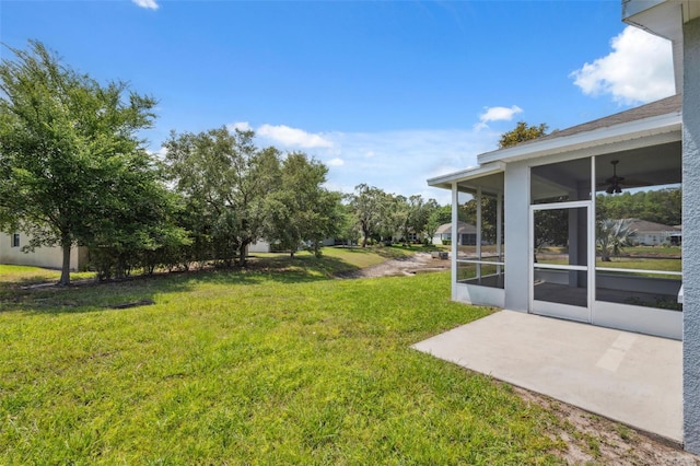 11220 Godwit Ct, New Port Richey, FL 34654 - view of green lawn with a sunroom, a patio area, and ceiling fan