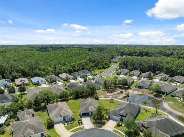 11220 Godwit Ct, New Port Richey, FL 34654 - aerial view of residential area featuring a heavily wooded area and a nearby body of water