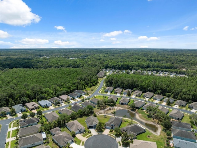 11220 Godwit Ct, New Port Richey, FL 34654 - aerial overview of property's location featuring a forest and nearby suburban area