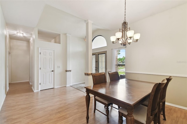 1831 Stable Trl, Palm Harbor, FL 34685 - dining room featuring baseboards, a notable chandelier, and light wood finished floors