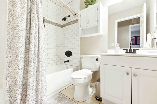 full bath featuring vanity, shower / bath combo with shower curtain, toilet, and visible vents
