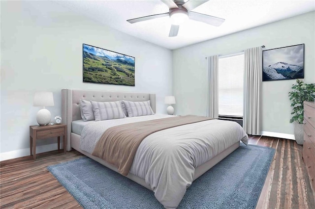 bedroom with baseboards, a ceiling fan, and wood finished floors