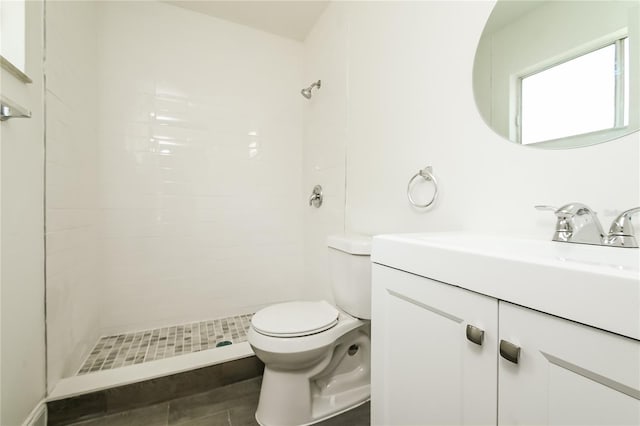 full bath with toilet, a shower stall, and vanity