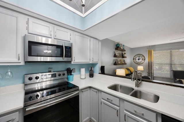 404 Hammock Pine Blvd Unit 404, Clearwater, FL 33761 - kitchen with a sink, light countertops, and stainless steel appliances