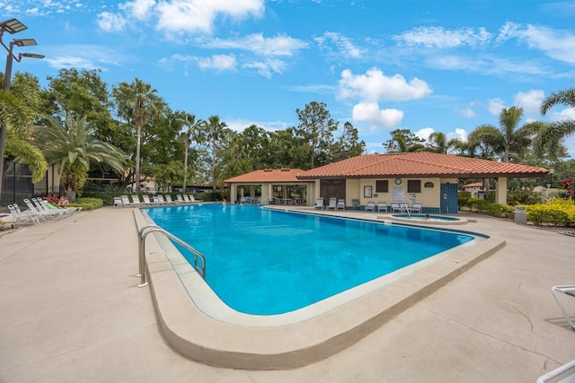 404 Hammock Pine Blvd Unit 404, Clearwater, FL 33761 - community pool featuring a hot tub, fence, and a patio area